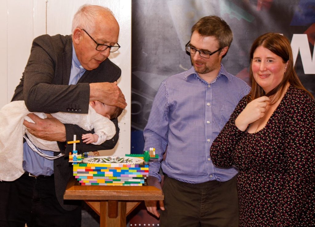 baby being baptised by vicar